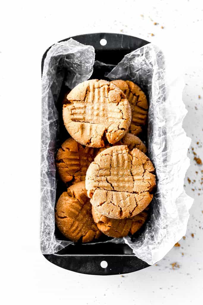 Peanut Butter Cookies stacked together in a loaf pan.