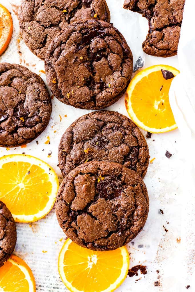 Vegan orange chocolate cookies and orange slices.