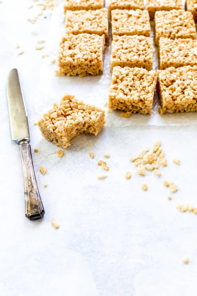 Rice krispie treat with a bite taken out of it.