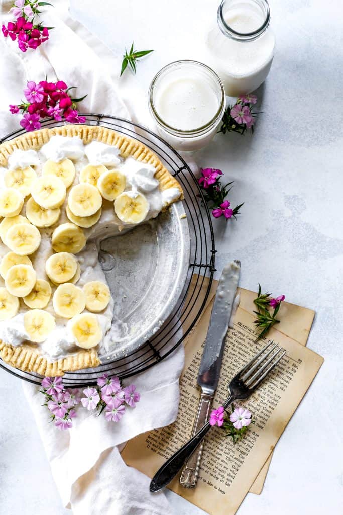 Vegan Banana Cream Pie with two slices missing.