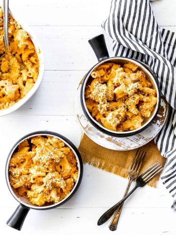 Dish of vegan mac n cheese and two bowls of vegan mac n cheese.