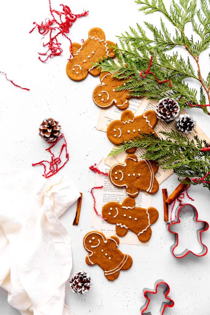 Chain of vegan gingerbread men and women arranged to appear they are holding hands.