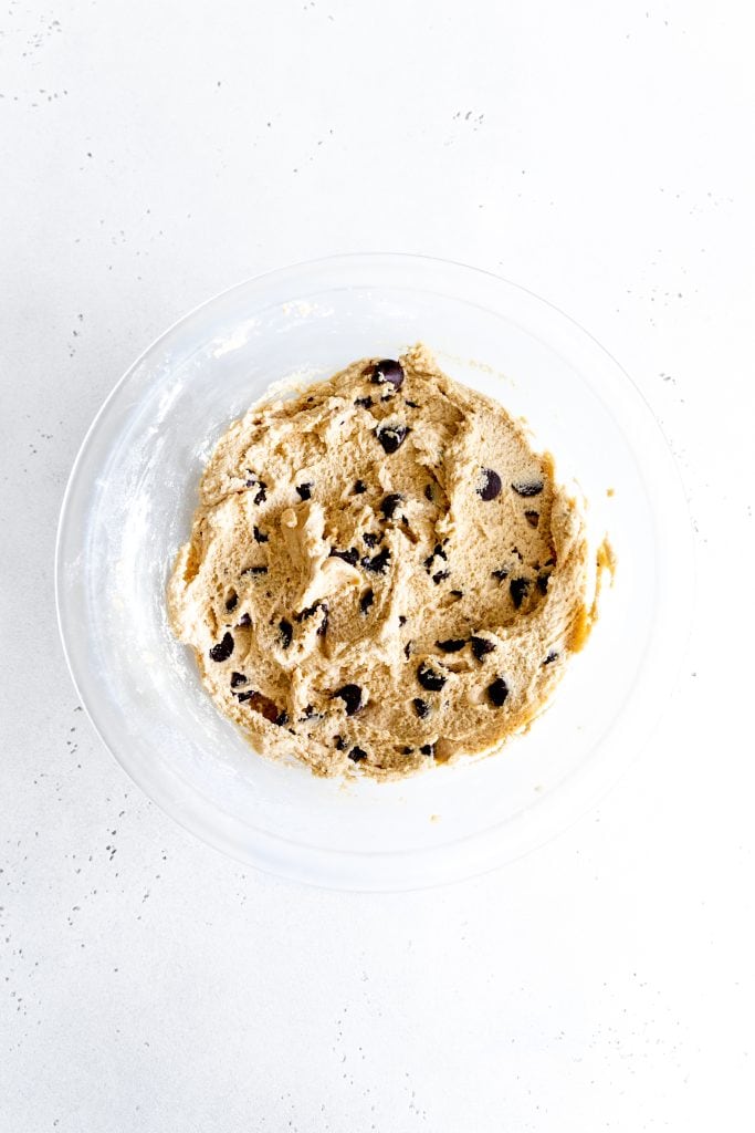 Glass bowl filled with vegan chocolate chip cookie dough.