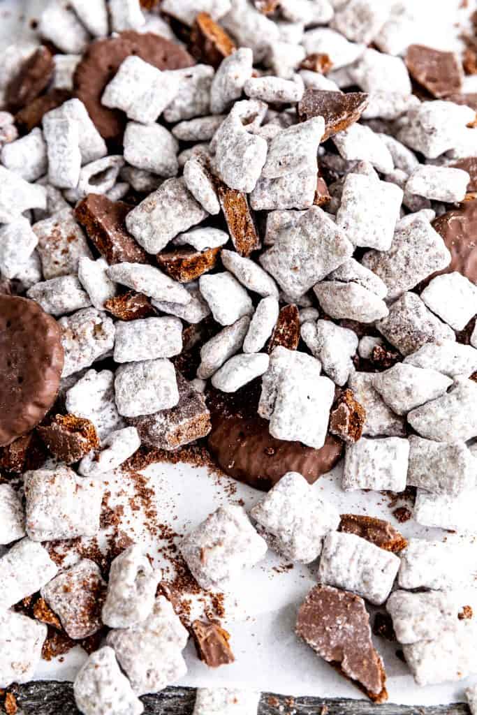 Pile of thin mint muddy buddies on a baking sheet.