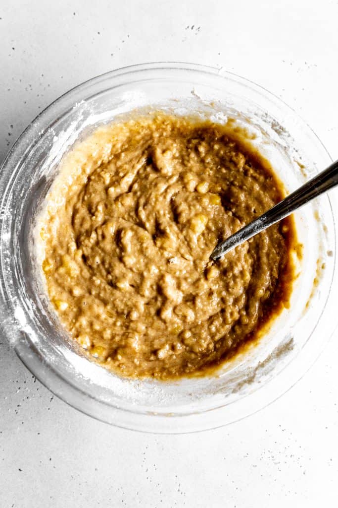 Glass bowl of vegan banana bread batter.