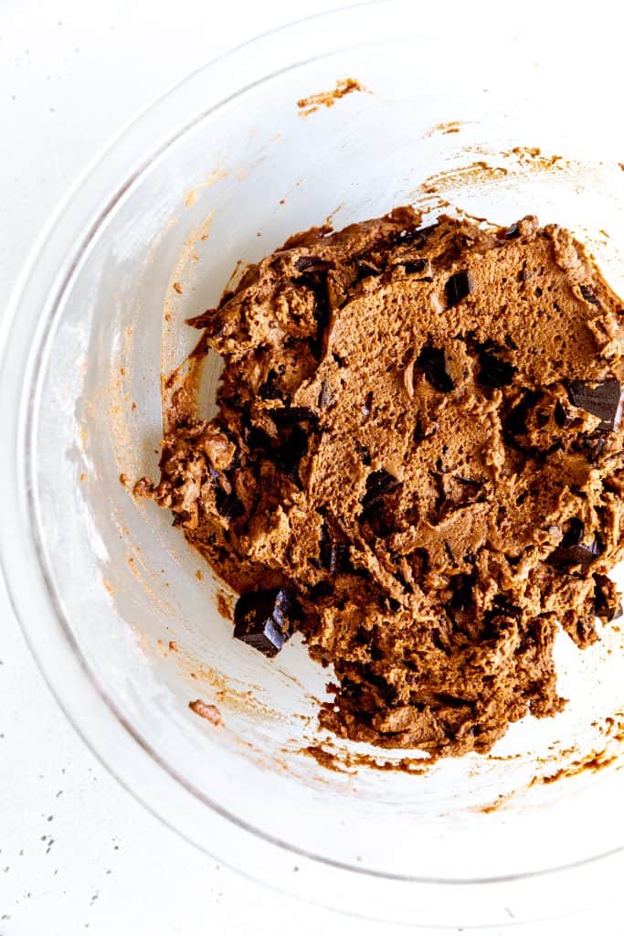 Glass bowl filled with double chocolate chip cookie dough.