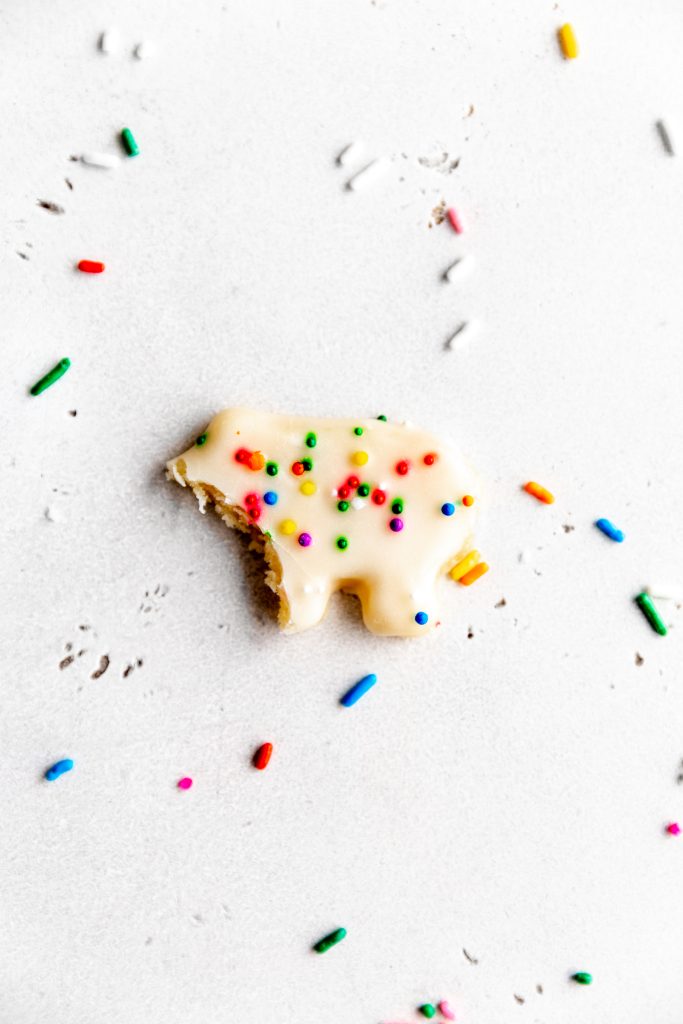 White, hippo-shaped vegan animal cookie with a bite taken out of it.