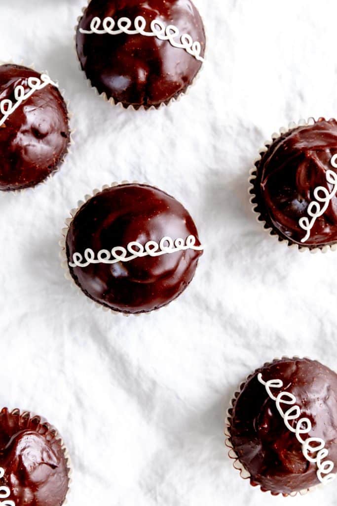 Vegan hostess cupcakes on a white linen tablecloth.