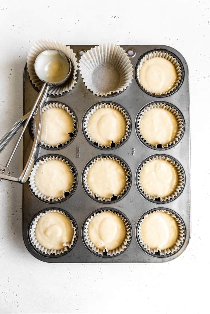 Tray of unbaked vanilla cupcakes.