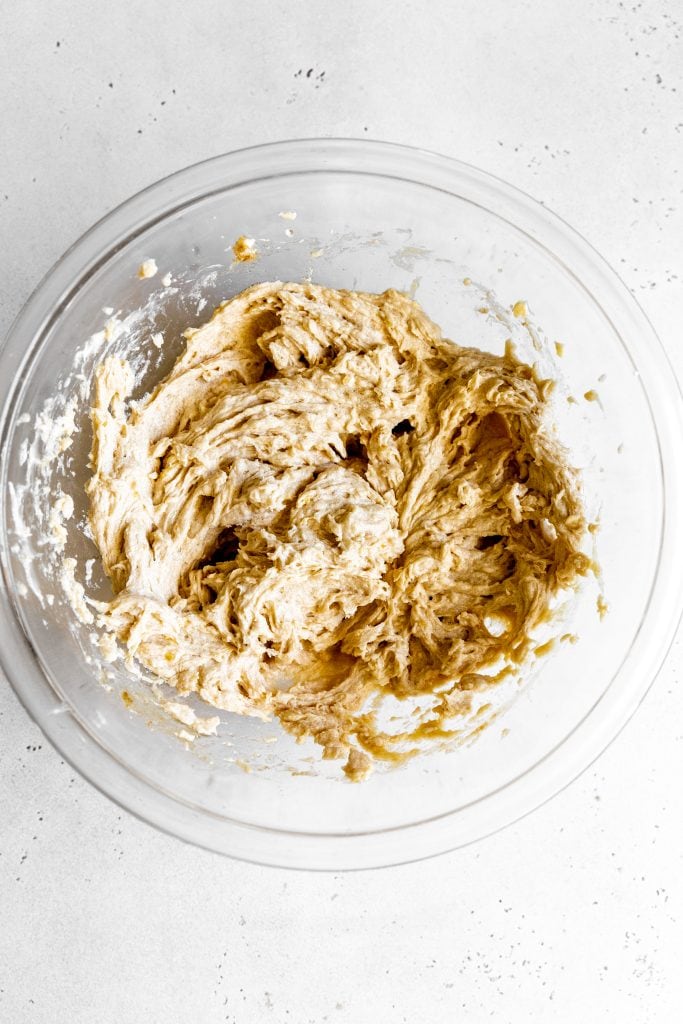 Creamed butter and sugar in a glass bowl.