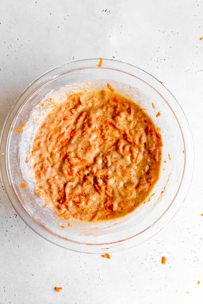 Glass bowl of vegan carrot cake batter.