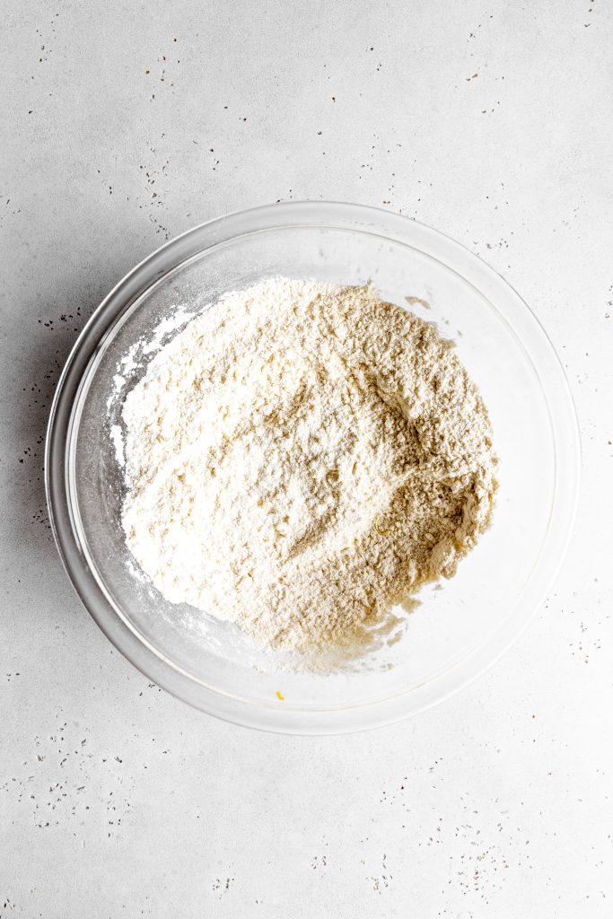 Dry ingredients for scones in a glass bowl.