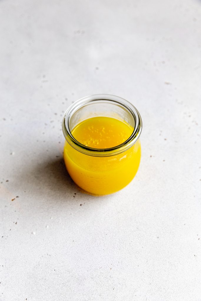 Glass jar filled with lemon curd.