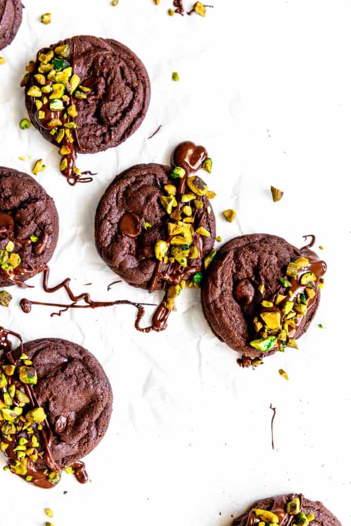 Double chocolate cookies drizzled in melted chocolate and topped with chopped pistachios.