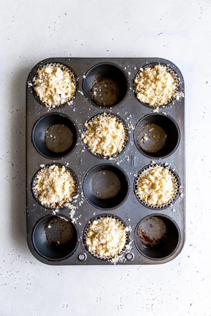 Unbaked lemon blueberry muffins in a cupcake pan.