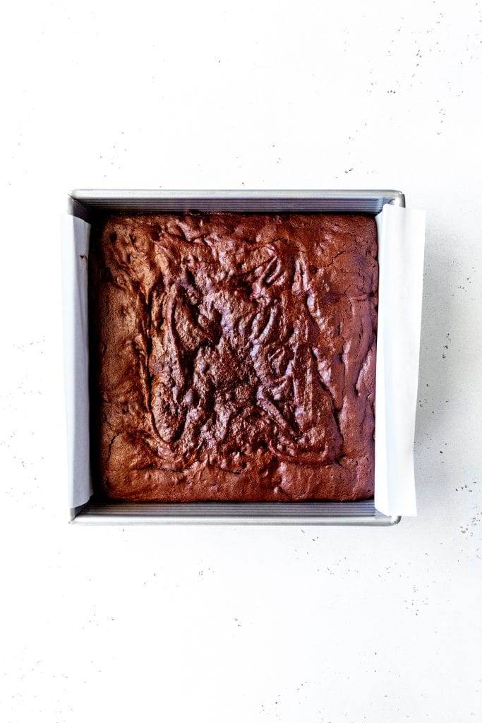 Square pan of baked vegan brownies.