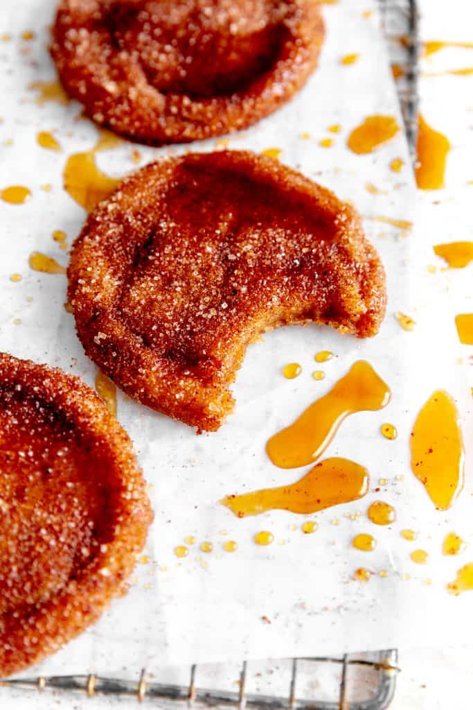 Apple cider cookie with a bite taken out of it.