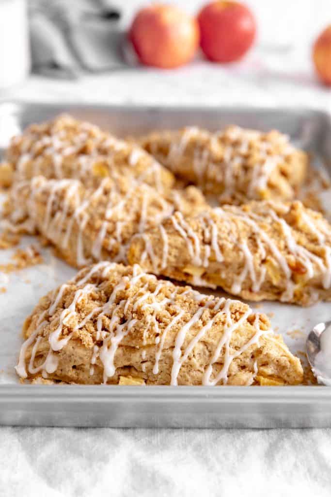 Close up of apple cinnamon scone on a baking sheet.