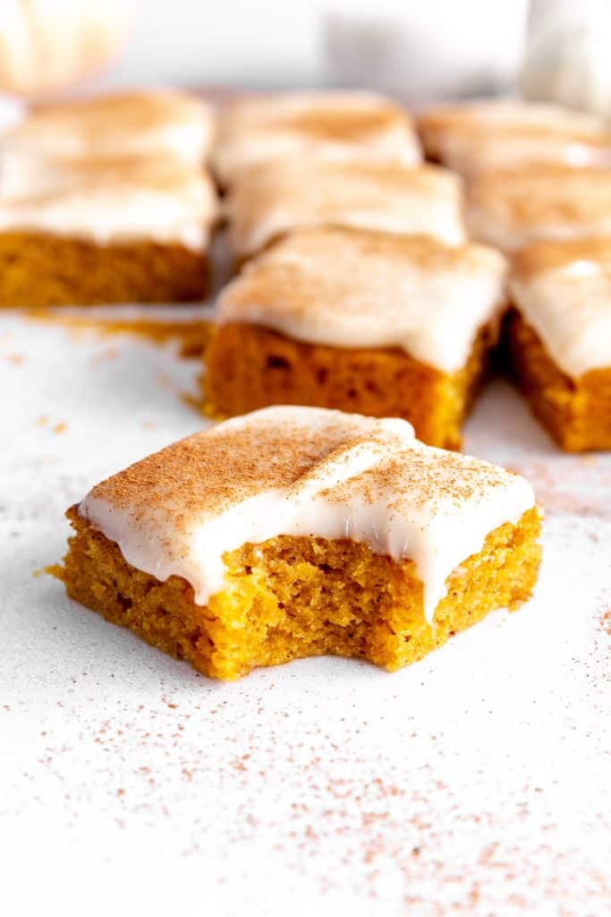 Vegan pumpkin bar with a bite taken out of it.