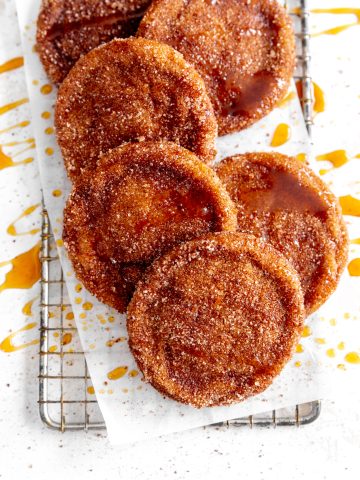 Vegan apple cider cookies on a wire cooling rack.