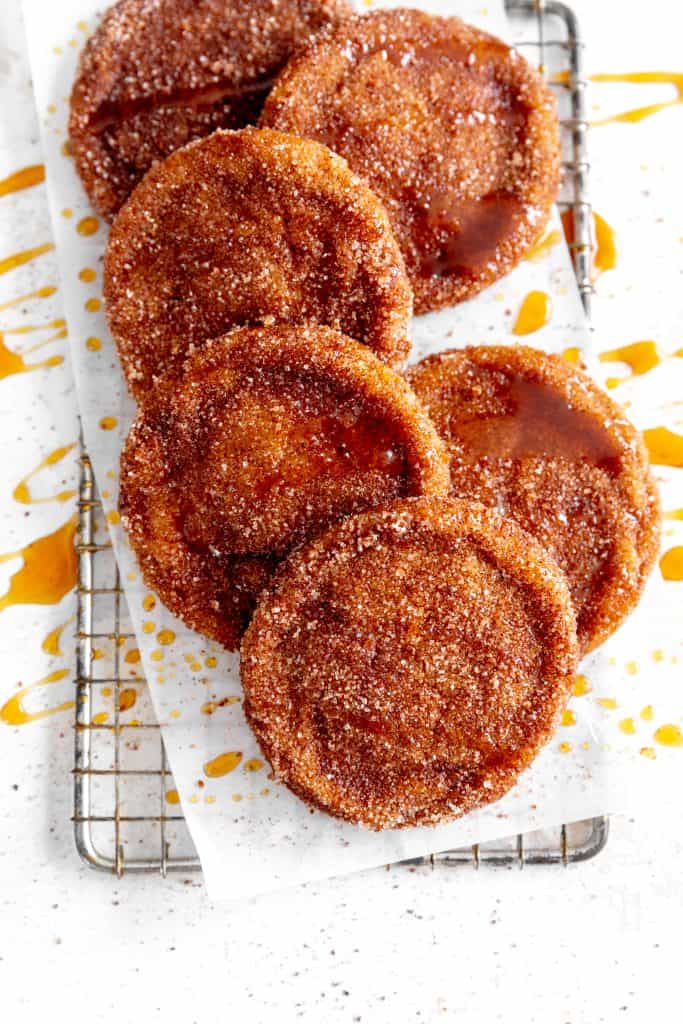 Vegan apple cider cookies on a wire cooling rack.