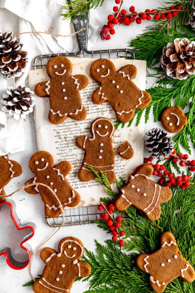 Gingerbread people cookies on a wire cooling rack.