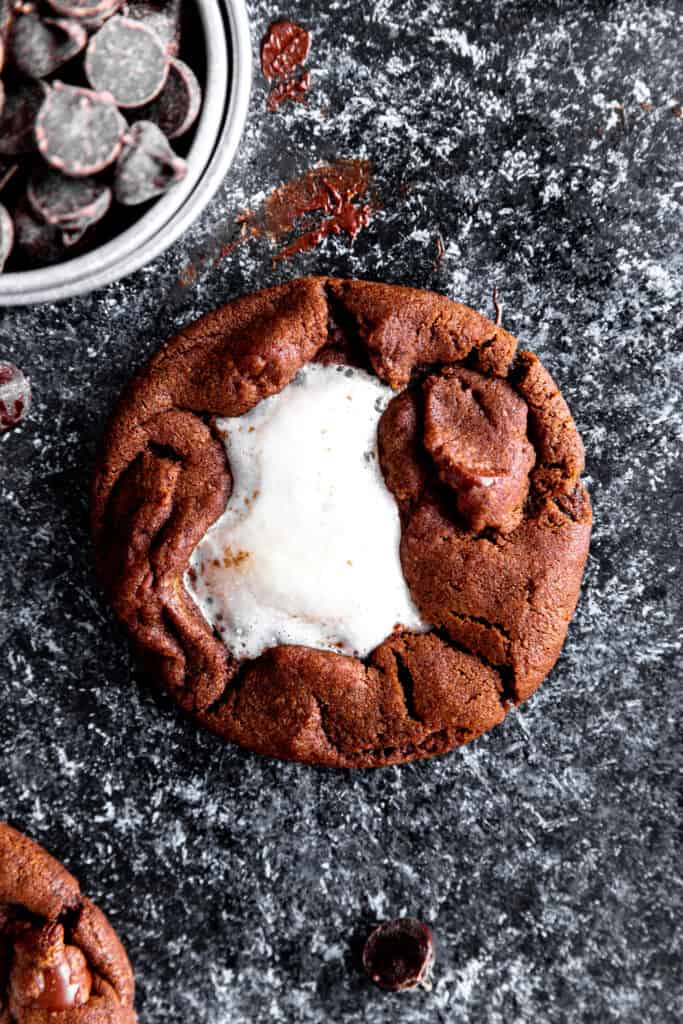 Hot chocolate cookie and a cup of chocolate chips.