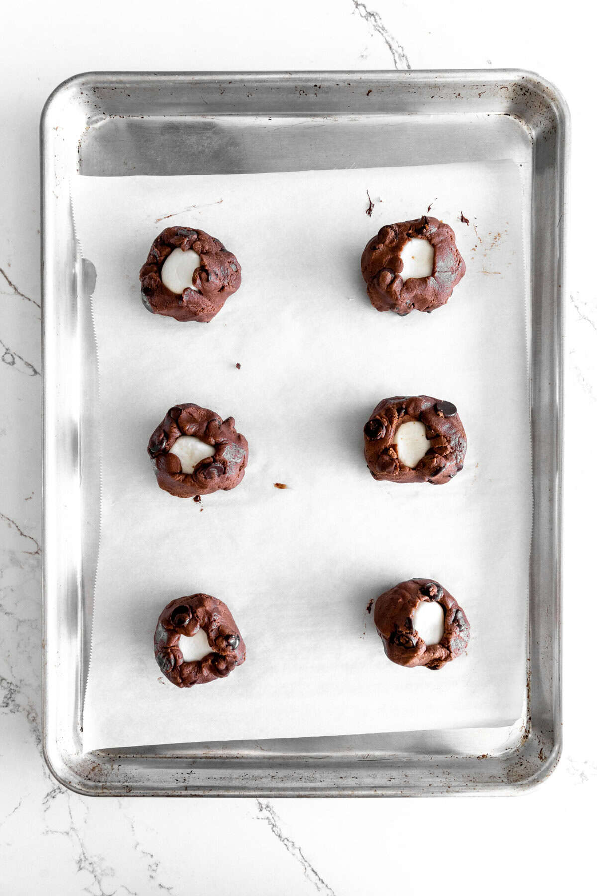 Unbaked hot chocolate cookies on a baking sheet,