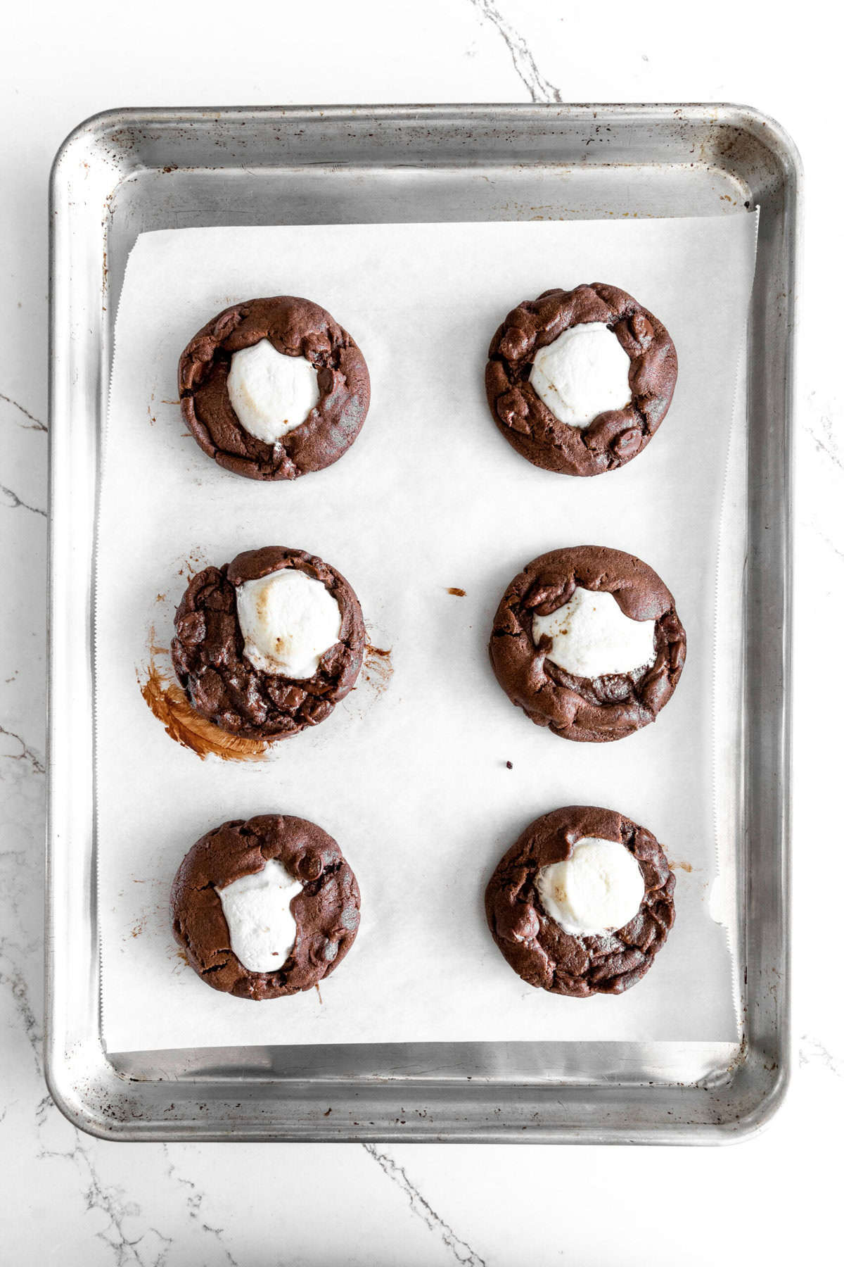 Hot chocolate cookies on a baking sheet.