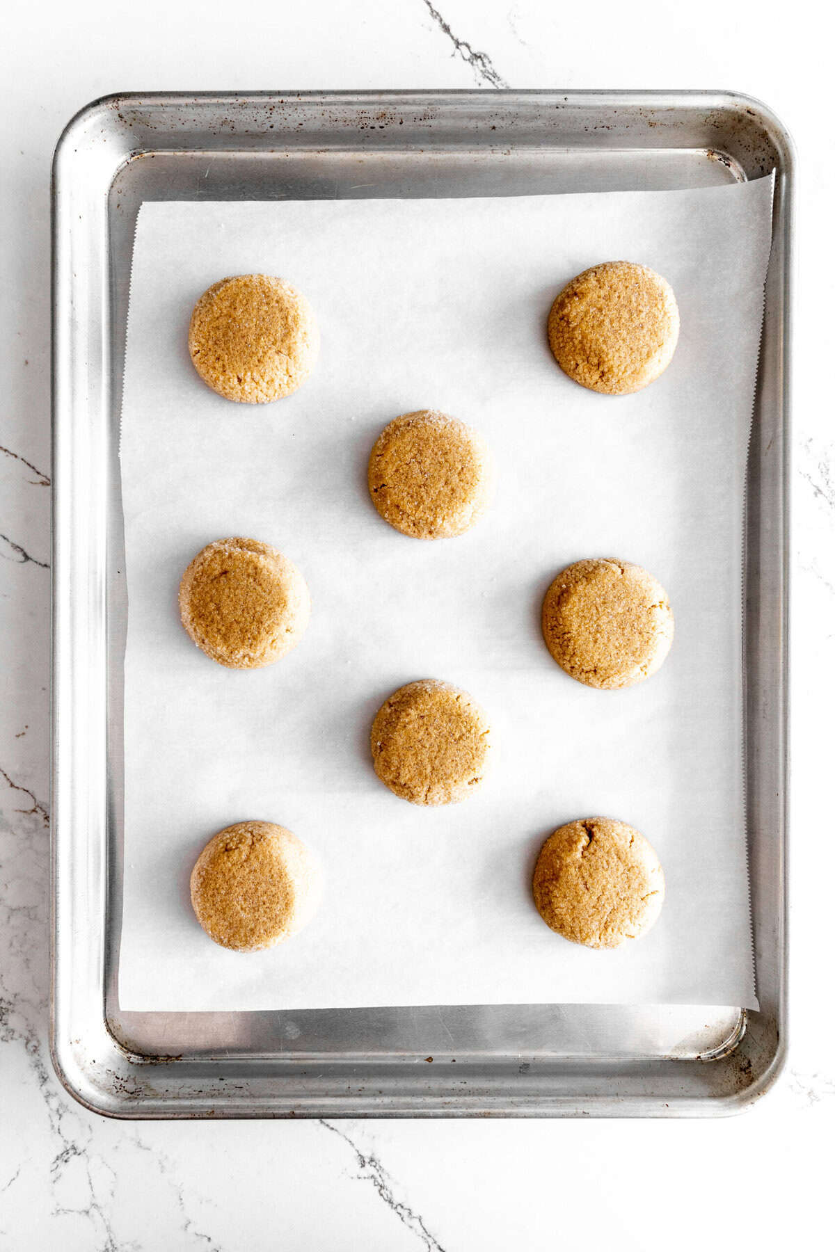 Peanut butter cookies on a baking sheet.