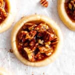 Vegan pecan pie cookie and pecan pieces.