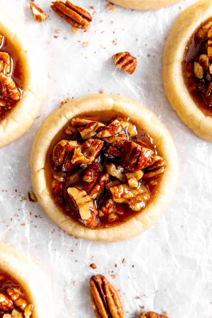 Vegan pecan pie cookie and pecan pieces.