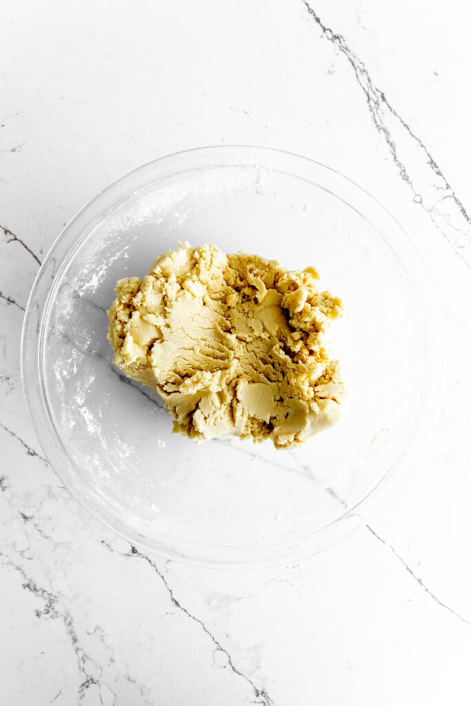 Glass bowl of butter cookie dough.