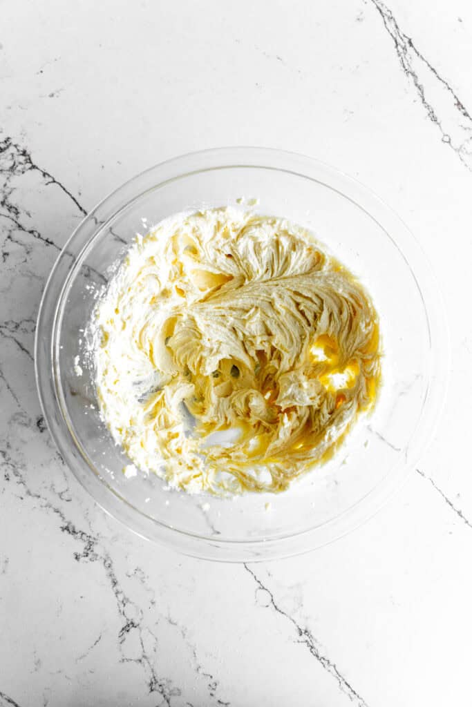 Creamed butter and sugar in a glass bowl.