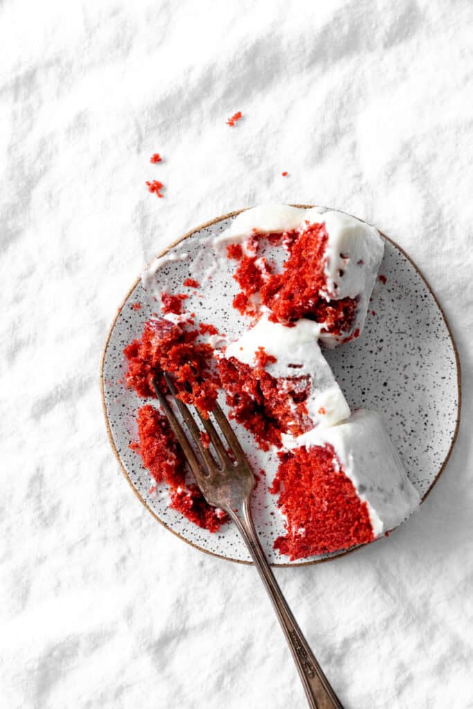 Deconstructed slice of red velvet cake.