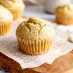 Almond poppy seed muffin on a cutting board.