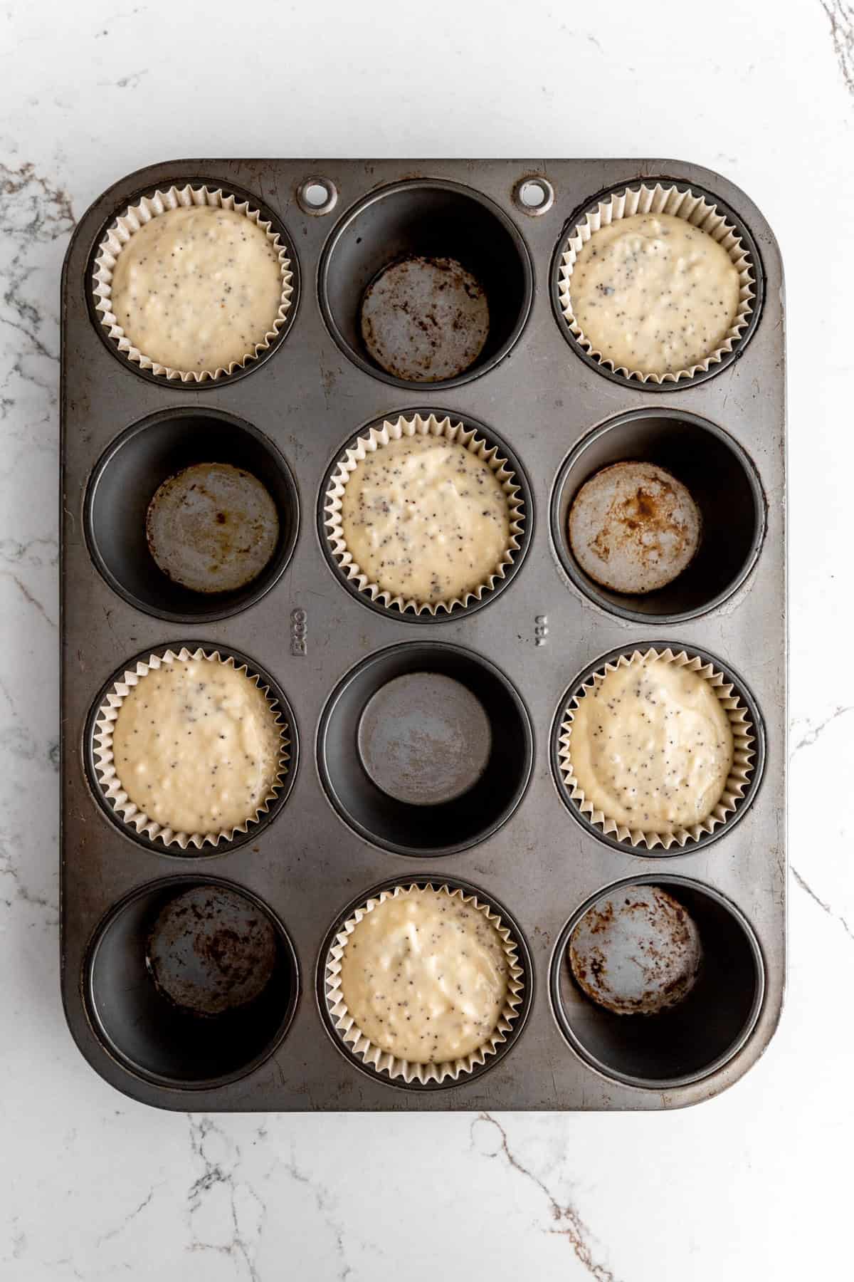 Unbaked vegan almond poppy seed muffins.