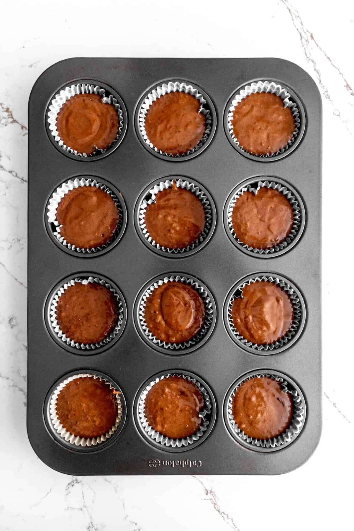 Pan of unbaked chocolate cupcakes.