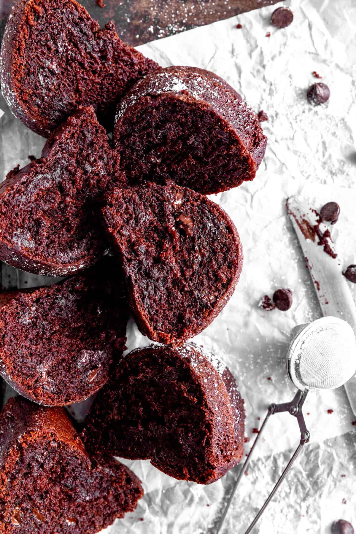 Slices of Kahlúa cake laid out on a baking sheet with a knife.