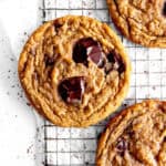 Toffee chocolate chip cookie on a wire rack.