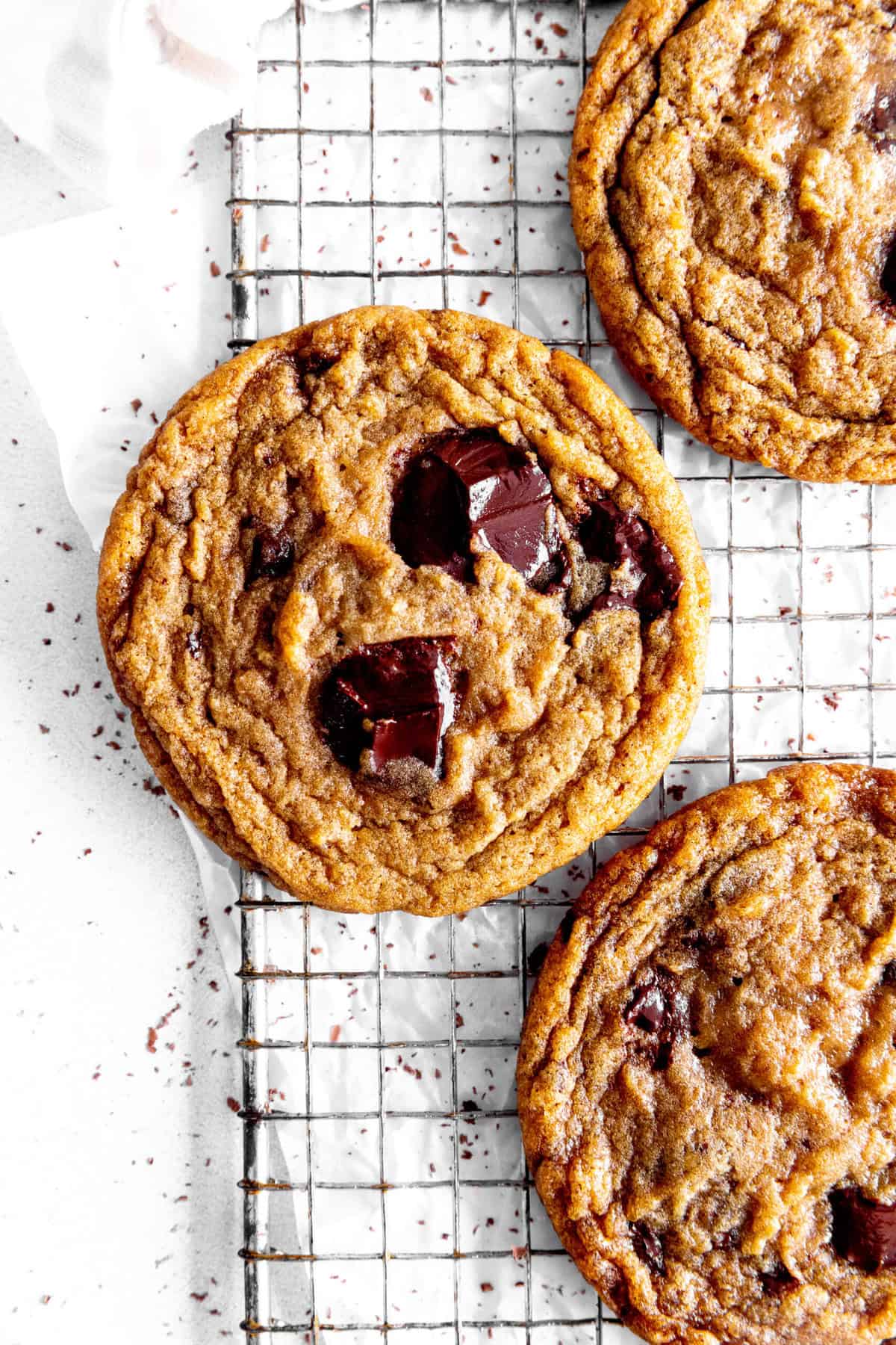 Toffee chocolate chip cookie on a wire rack.