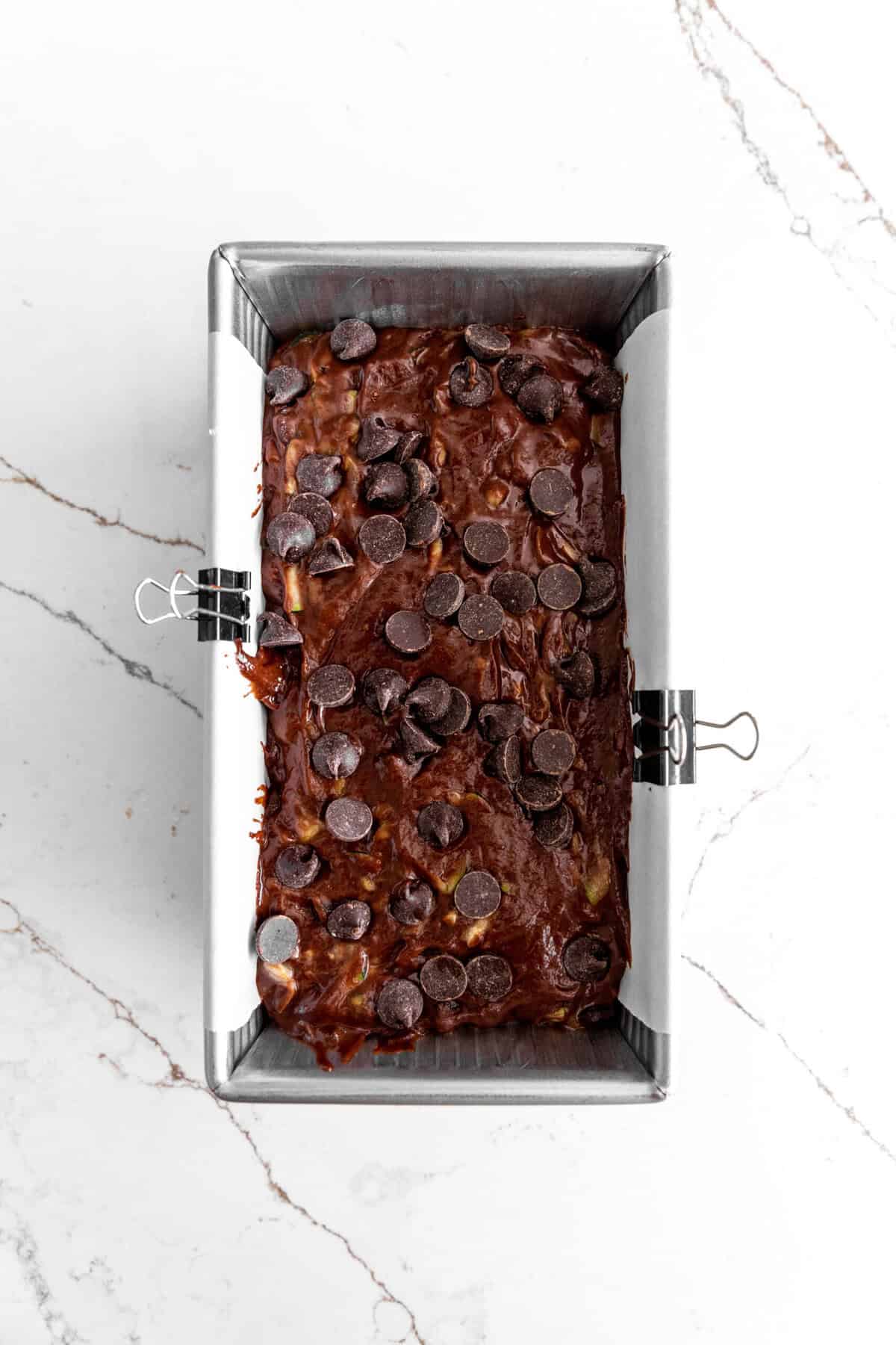 Unbaked chocolate zucchini bread in a loaf pan.