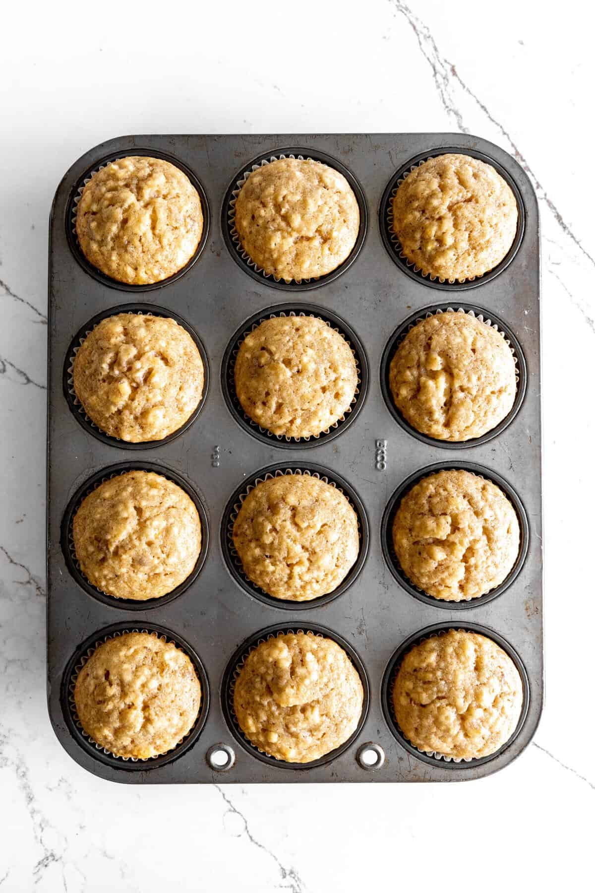 Baked banana cupcakes in a baking pan.