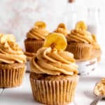 Peanut butter banana cupcake topped with a banana chip.