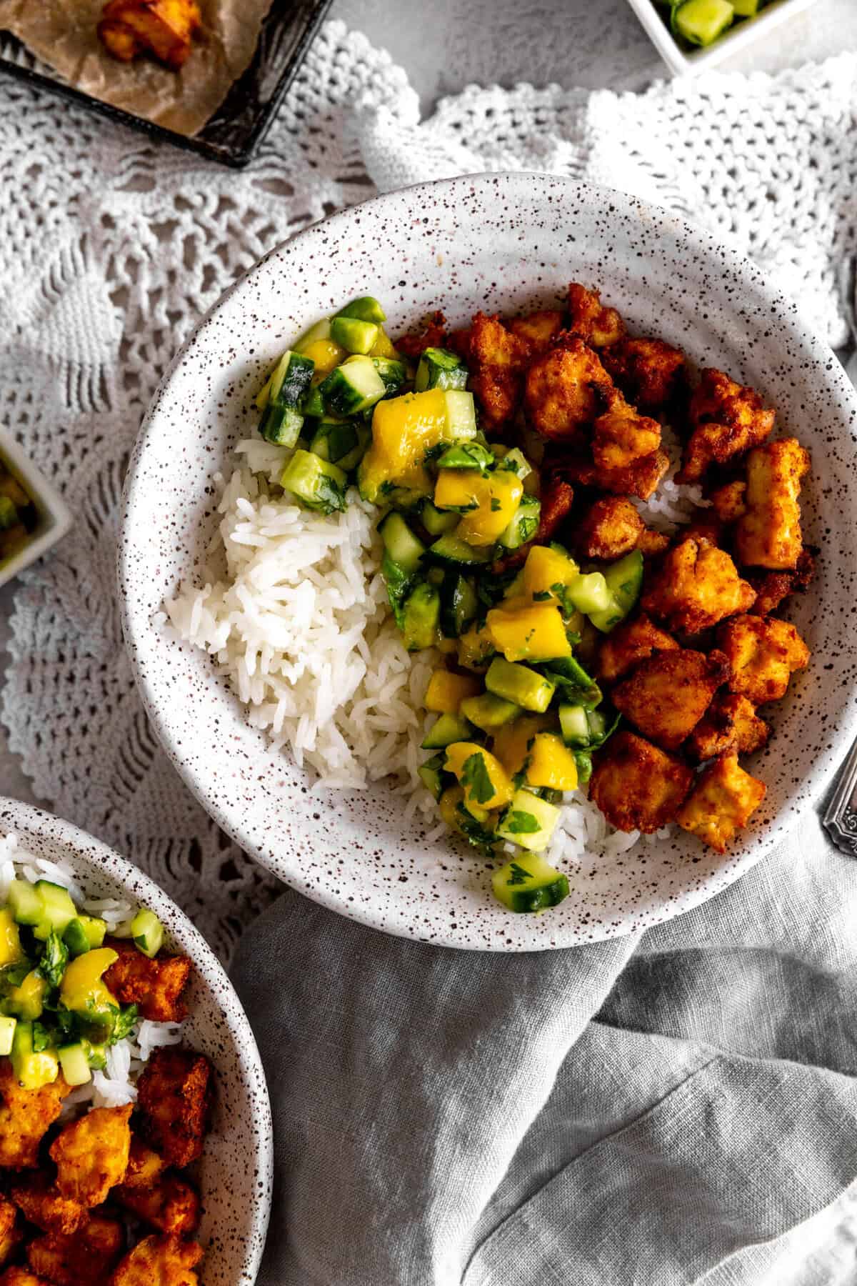 Bowls of spiced tofu, cucumber salsa and rice.