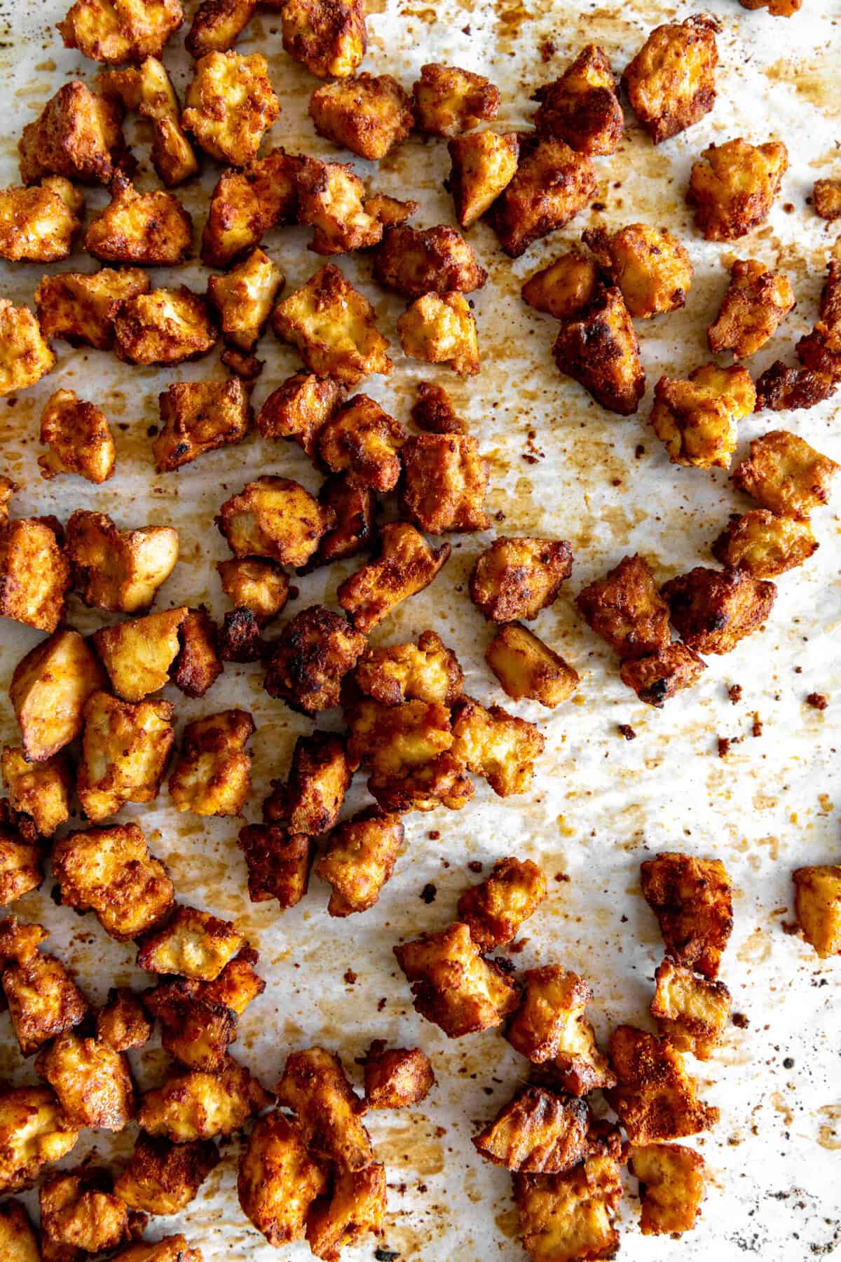 Baked tofu on a baking sheet.