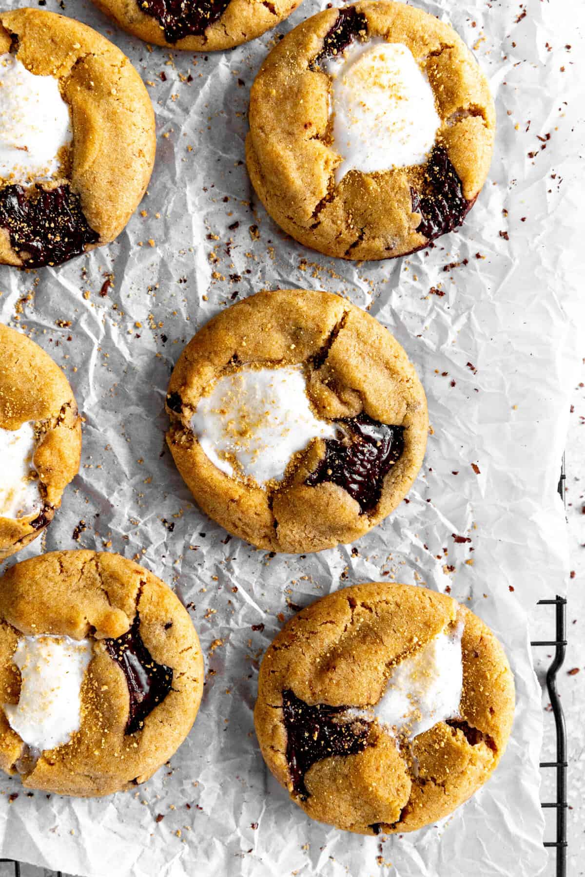 S'mores cookies on parchment paper on a cooling rack.