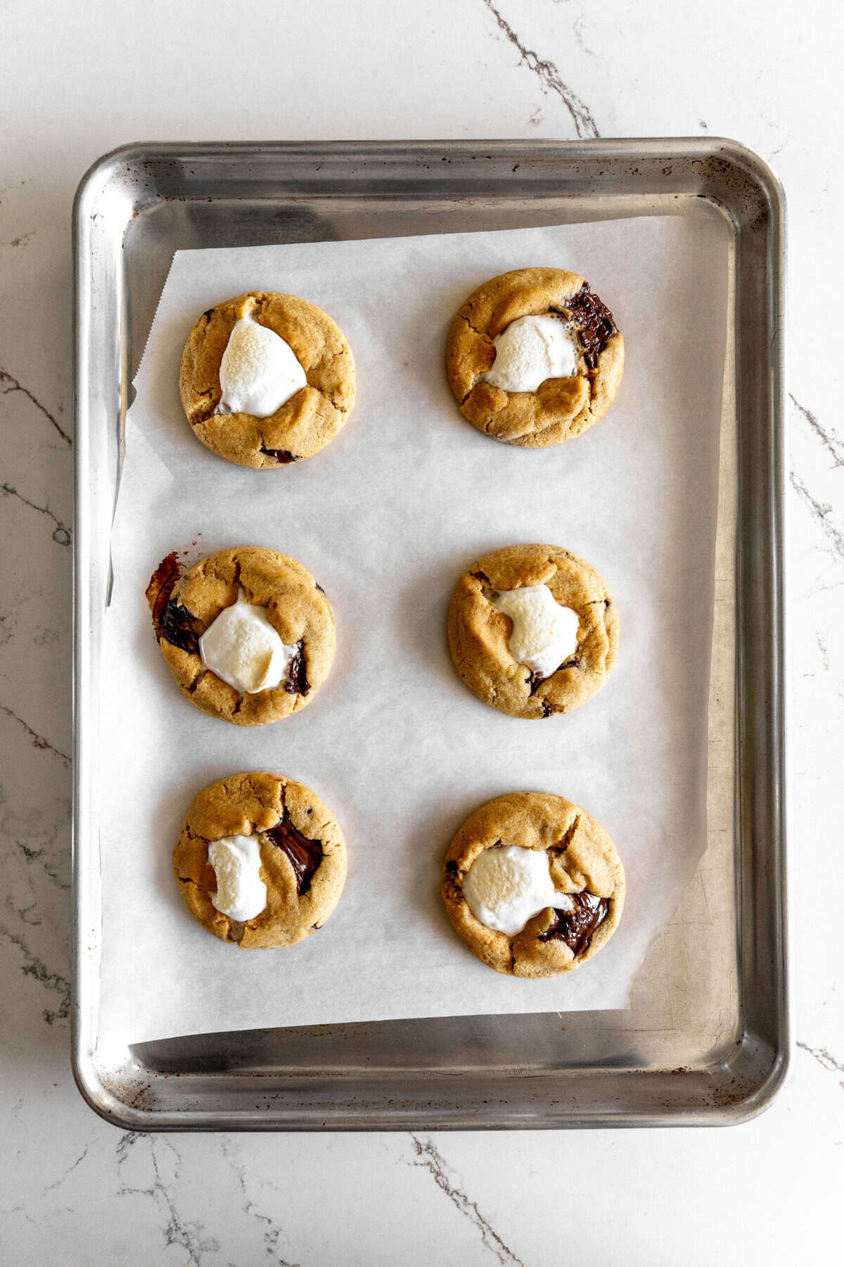 Baked s'mores cookies on a baking sheet.