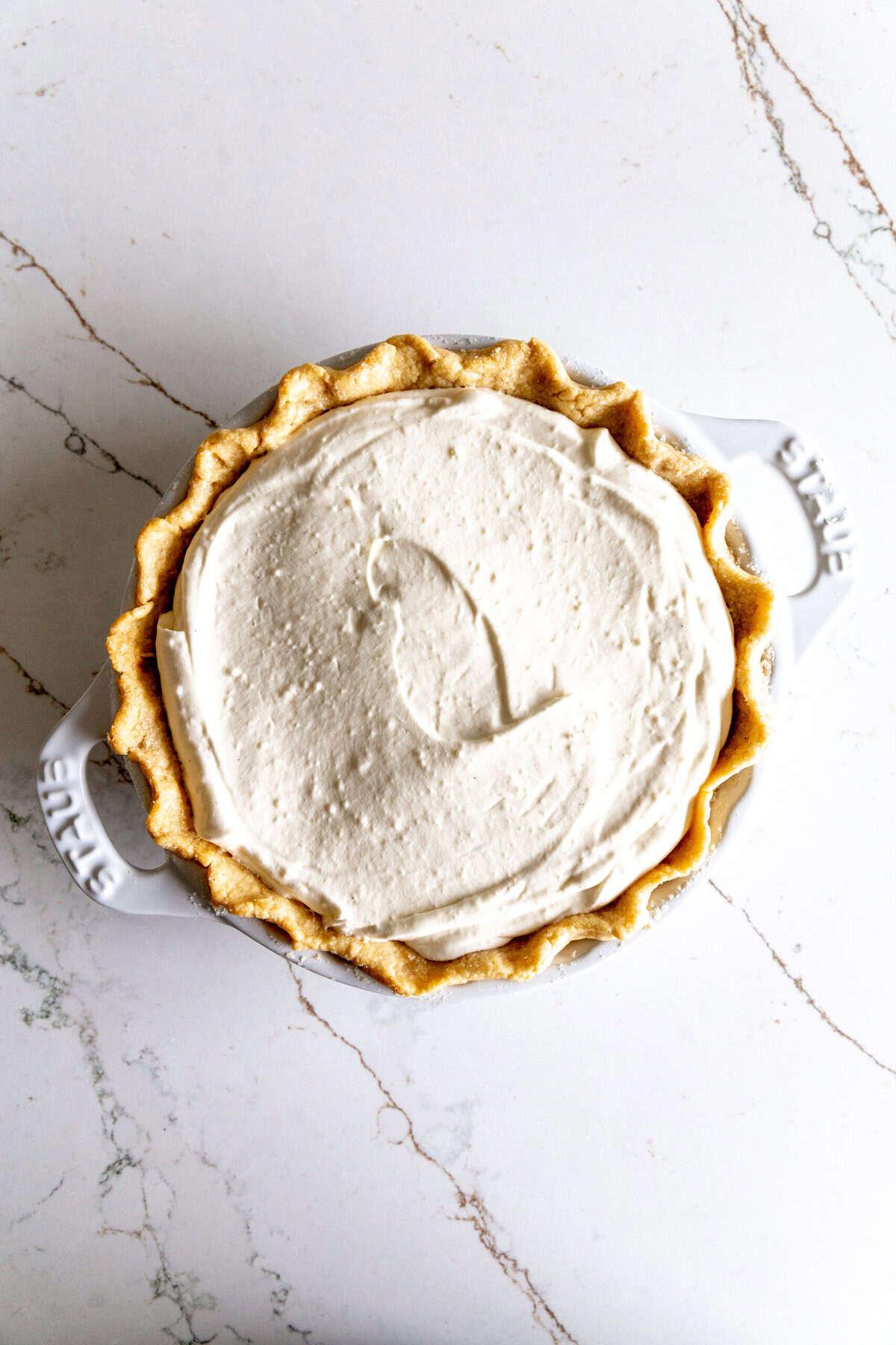 Baked piecrust filled with cream filling.