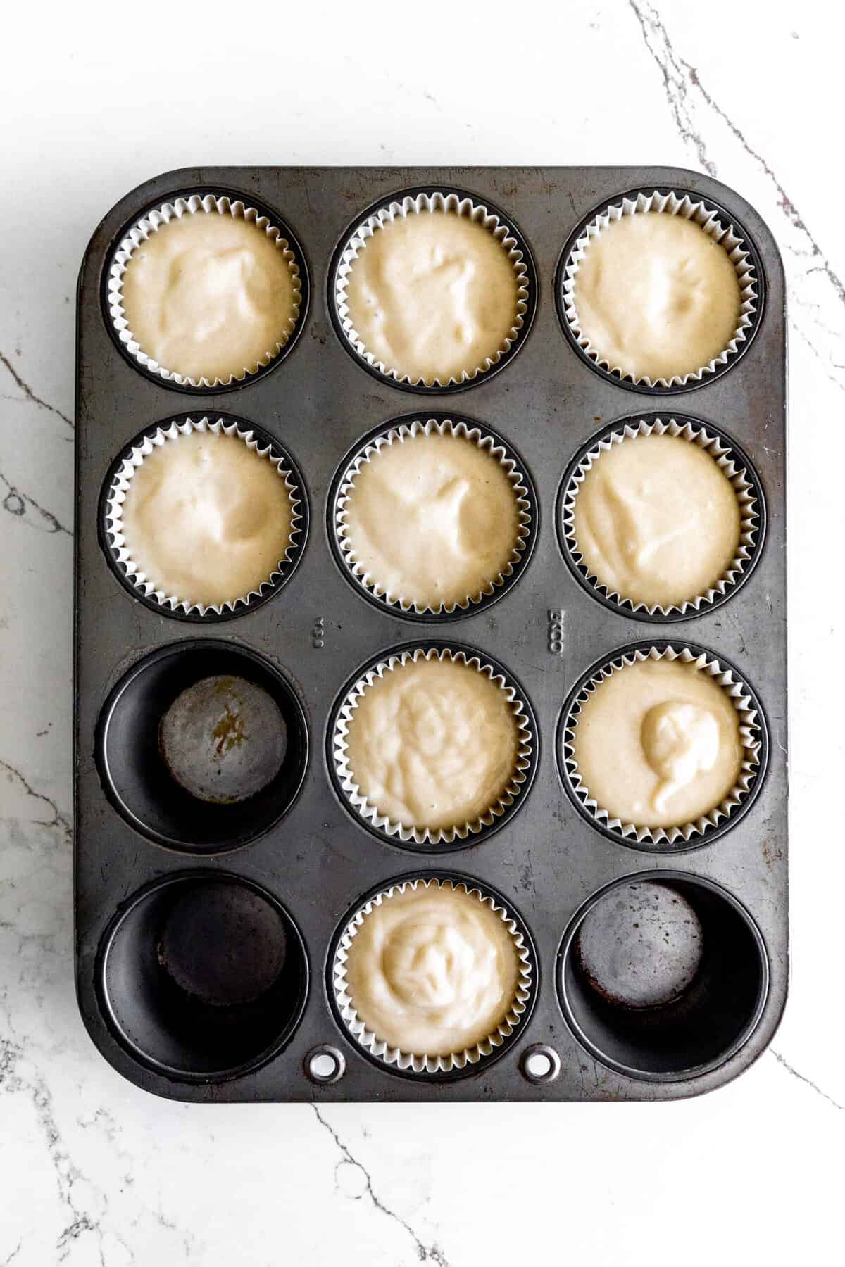 Unbaked cupcakes in a baking tray,